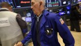 Wall Street termine en baisse, retient son souffle avant Jackson Hole